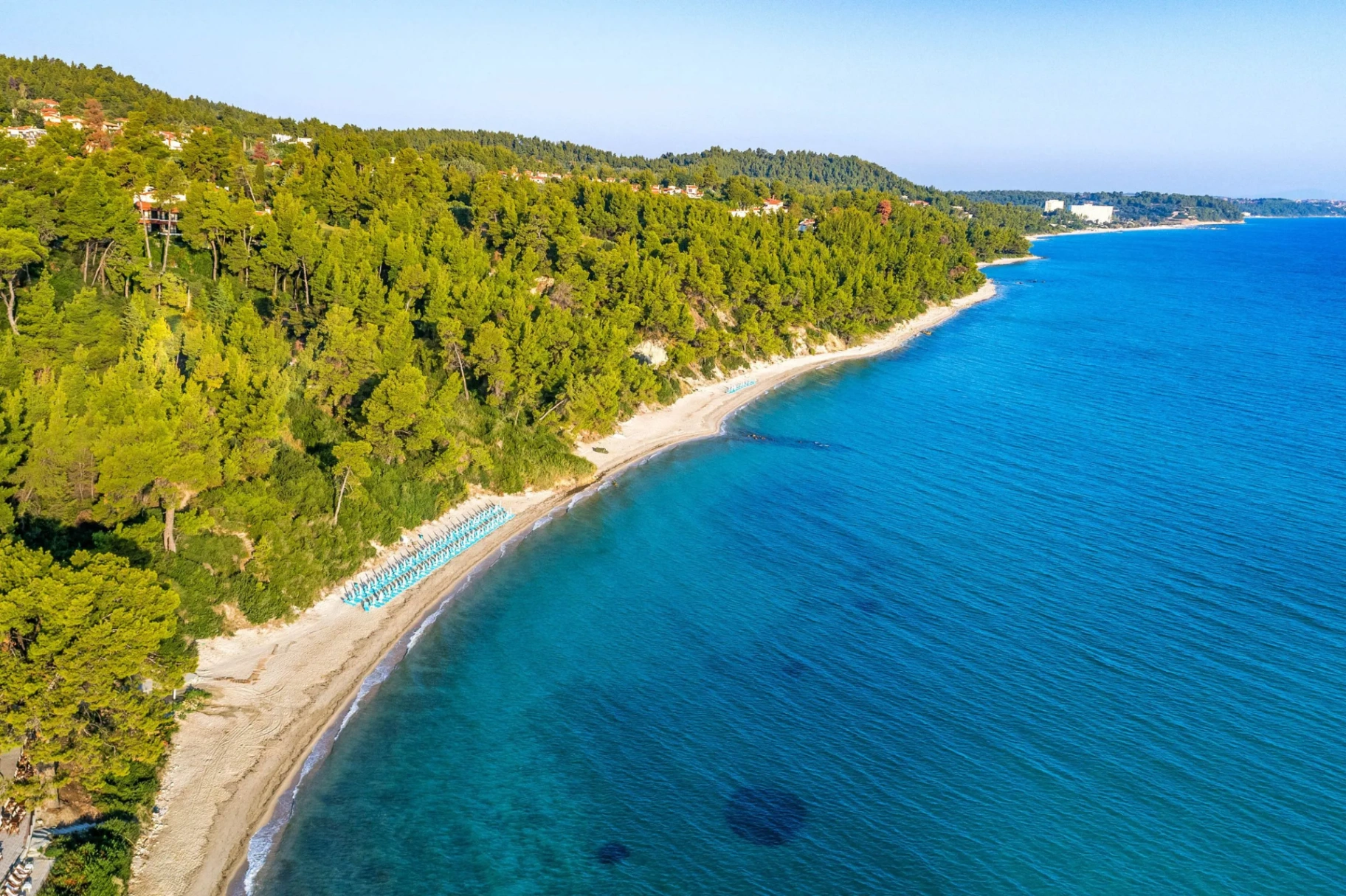 Aerial view of Kriopigi Beach at golden hour